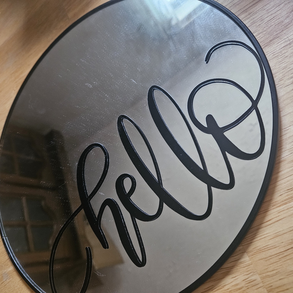 Round Mirror with 'Hello' Script